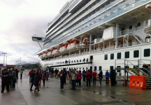 Tourists disembark from the Ruby Princess this spring, beginning the 2015 tour season in Ketchikan. The Ruby is permitted to discharge graywater while docked. (KRBD file photo).