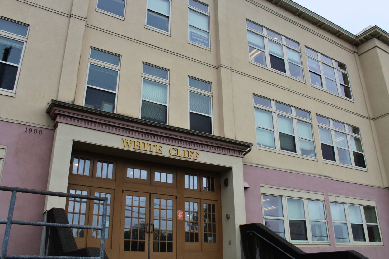 the front of a building with the lettering "White Cliff"